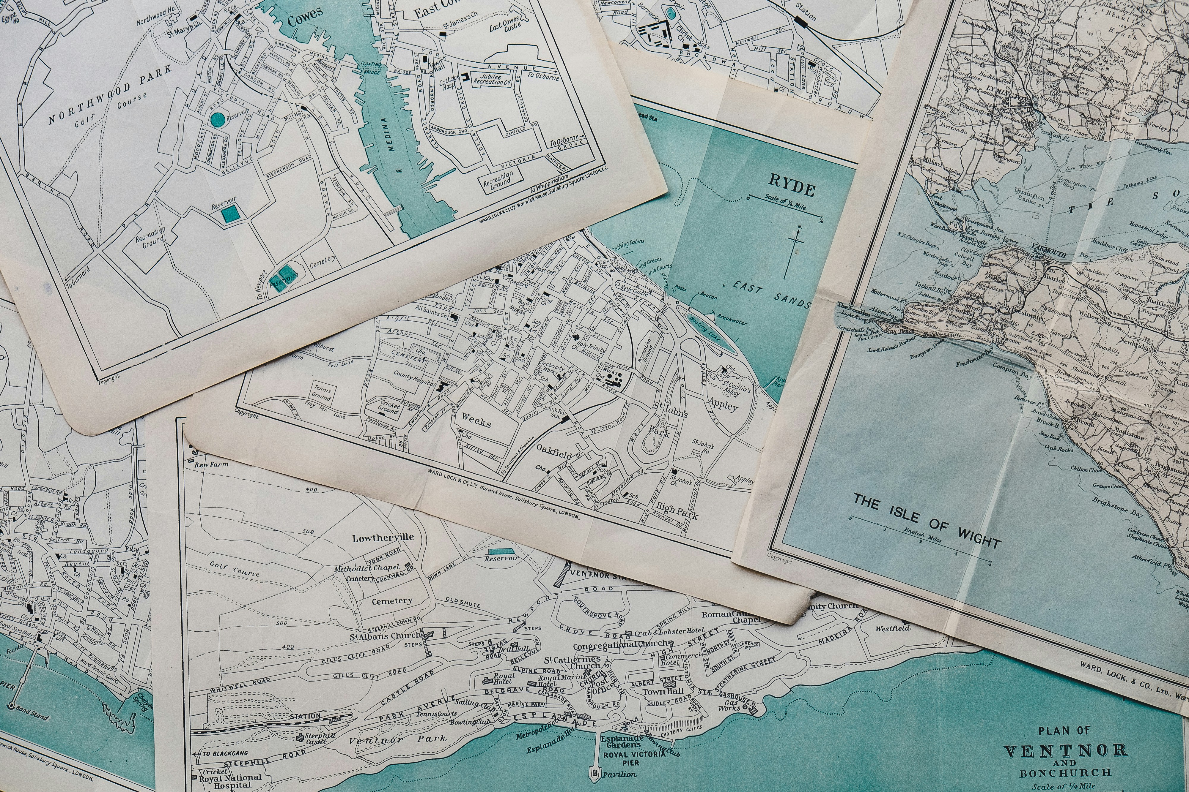 Pile of Maps layed out on table